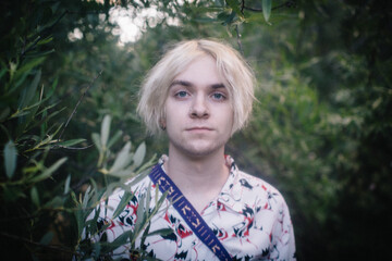 Soft Portrait of Blue Eyed Teen Boy in the Woods