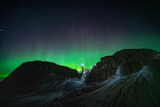 Exploring Dinosaur Provincial Park Under Aurora Borealis