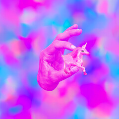 Contemporary art minimal collage. Hand holds pink unicorn. Dream and fantasy concept