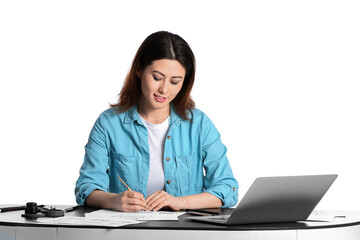 Female Asian calligraphist at table on white background