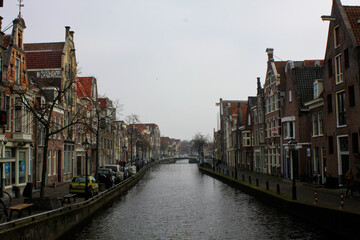View on the architecture of old holland buildings on both sides of the canal embankment