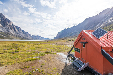 Emergency shelter with solar panel in Akshayuk Pass, Baffin Island.