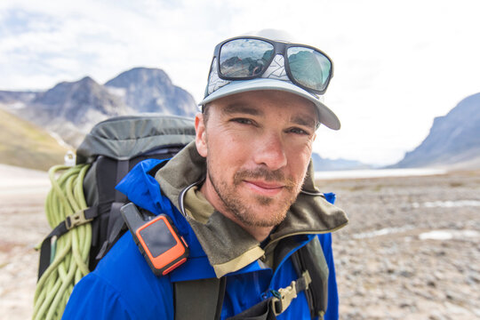 Portrait of mountaineer in Akshayuk Pass, Baffin Island, Canada