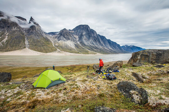 Mountaineer camping above the Weasel River, Baffin Island.