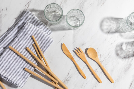 Zero Waste Cutlery and Glasses on Marble Backdrop