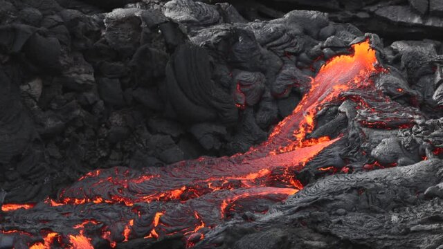 Lava flowing from active volcano in Iceland