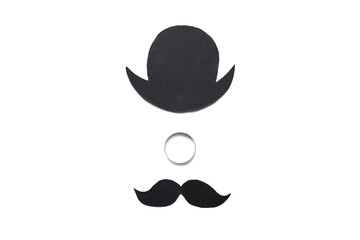 Wedding ring, paper hat and mustache on white background