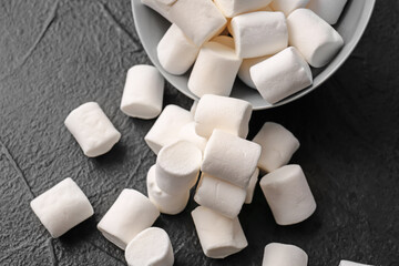 Tasty marshmallows on dark background