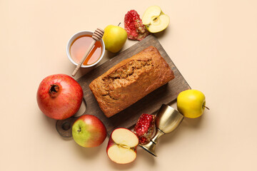Bread with honey, sacramental goblet, pomegranate and apples on light background. Rosh hashanah (Jewish New Year) celebration