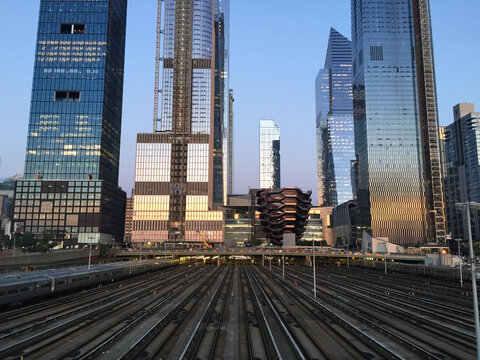 Hudson Yards reflections and the railway station during the sunset