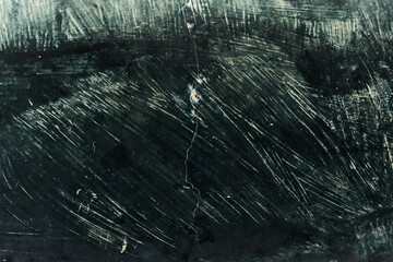 wall with broken wet, dry and destroyed advertisements in green color