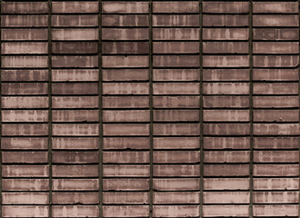 Red bricks wall arranged in parallel and symmetrical way