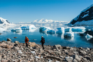 Tourists walking on Antarctic beach, Neko Harbor, Antarctic Peninsula