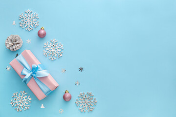 Beautiful Christmas decor and present on blue background