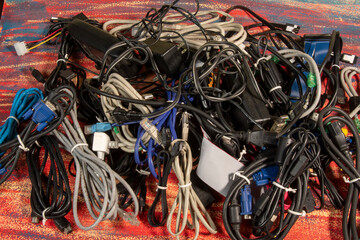 Disused stack of old computer cables and devices 1