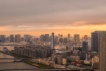 Naklejka na ściany i meble 夕方の豊洲から見える都市風景 Cityscape of Tokyo in the evening.