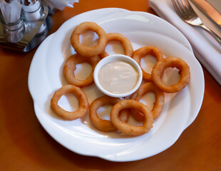Freshly fried onion or calamari rings served with dipping sauce