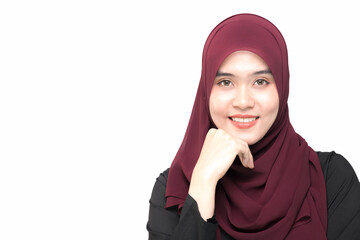 A beautiful Asian Muslim woman is smiling, on isolated white background, with copy space.