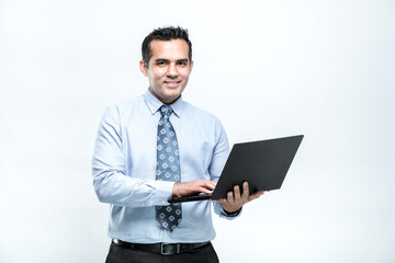 A man office worker is watching a job on a Computer Center laptop. His face with a smile