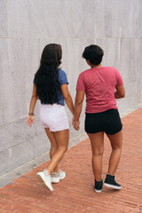 Lesbian couple walking down the street