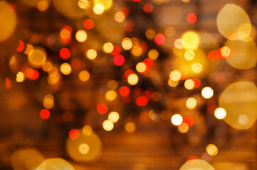 Defocused lights background. Twinkle lights bokeh. Defocused gold lights. Abstract holiday background. Beautiful shiny Christmas lights. Glowing magic bokeh.Blurred Christmas sparkles. Holidays