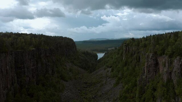 Aerial shot flying through Ouimet Canyon in 4K