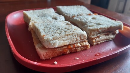 Tasty breads with strawberry jam