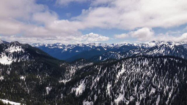 Drone Time Lapse of Mountain Valley with Clouds Rolling in Spring Season