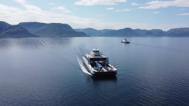 Ferry Mf Stavanger Crossing the Sognefjord heading for port of Lavik along road E39 Norway - Beautiful aerial crossing in front of bow before revealing ships side