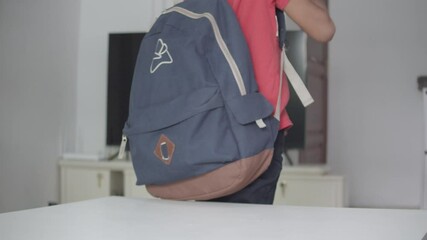 Elementary Student Going To School Took His Backpack On Table. - close up