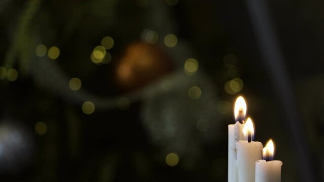 Burning candle on table in darkness, close up with space for text. Funeral symbol