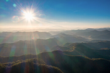 Fototapeta premium Aerial top view of Mountain and Mist at sunrise in the morning.
