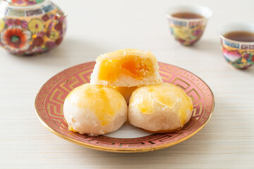 Chinese pastry moon cake with salted egg peanut or Spring Roll pastry with nuts and salted eggs