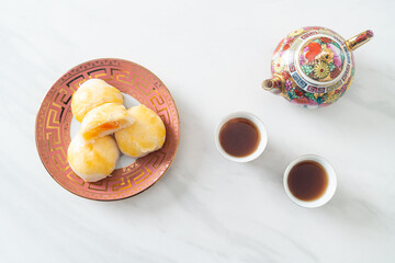 Chinese pastry moon cake with salted egg peanut or Spring Roll pastry with nuts and salted eggs
