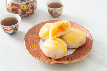Chinese pastry moon cake with salted egg peanut or Spring Roll pastry with nuts and salted eggs
