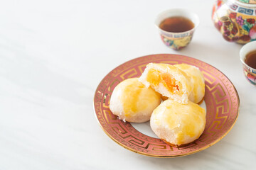 Chinese pastry moon cake with salted egg peanut or Spring Roll pastry with nuts and salted eggs