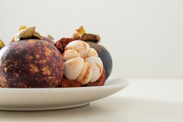 fresh mangosteen on white plate