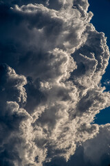 Roughly rising gray cumulonimbus clouds