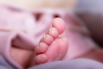 Newborn toes. Close up. Caucasian baby girl.