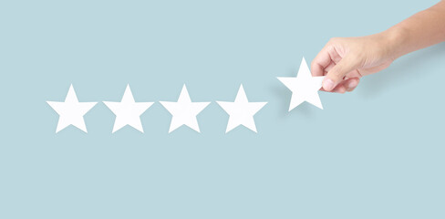 Hand of touching rise on increasing five stars. Increase rating evaluation