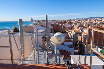 telecommunications tower of different mobile phone, radio and television operators with masts and microwave radio link antennas, 4g and deployment of 5g generation in cities and rural areas 