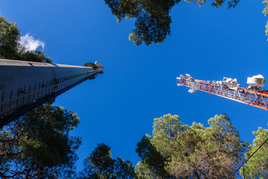 telecommunications tower of different mobile phone, radio and television operators with masts and microwave radio link antennas, 4g and deployment of 5g generation in cities and rural areas 