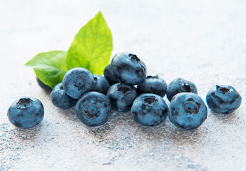 Blueberries on grey concrete background