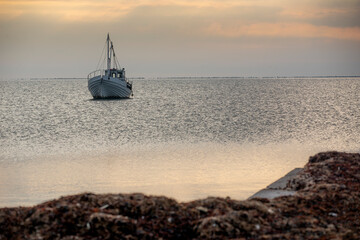 fishing boat on the sea at sunset, sunset by the sea with boat