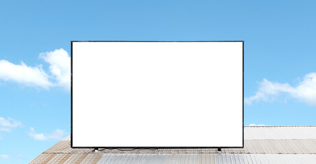 Fototapeta premium Outdoor billboard on roof and blue sky background with white background mock up. clipping path
