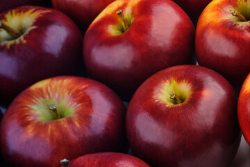 close up shot of a group of many freshness red apples with some yellow color marks
