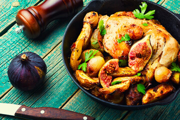 Baked chicken leg with potatoes and figs