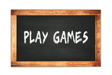 PLAY  GAMES text written on wooden frame school blackboard.