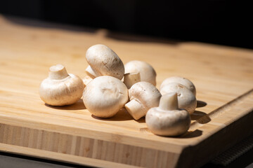 Straw mushroom is prepared on the wood board for ingredient of cooking.