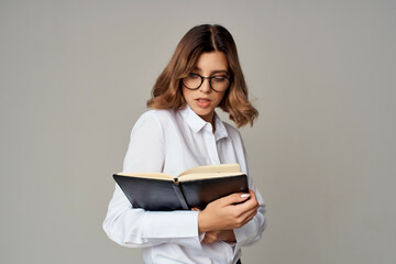 Fototapeta premium cheerful business woman secretary in white shirt documents work